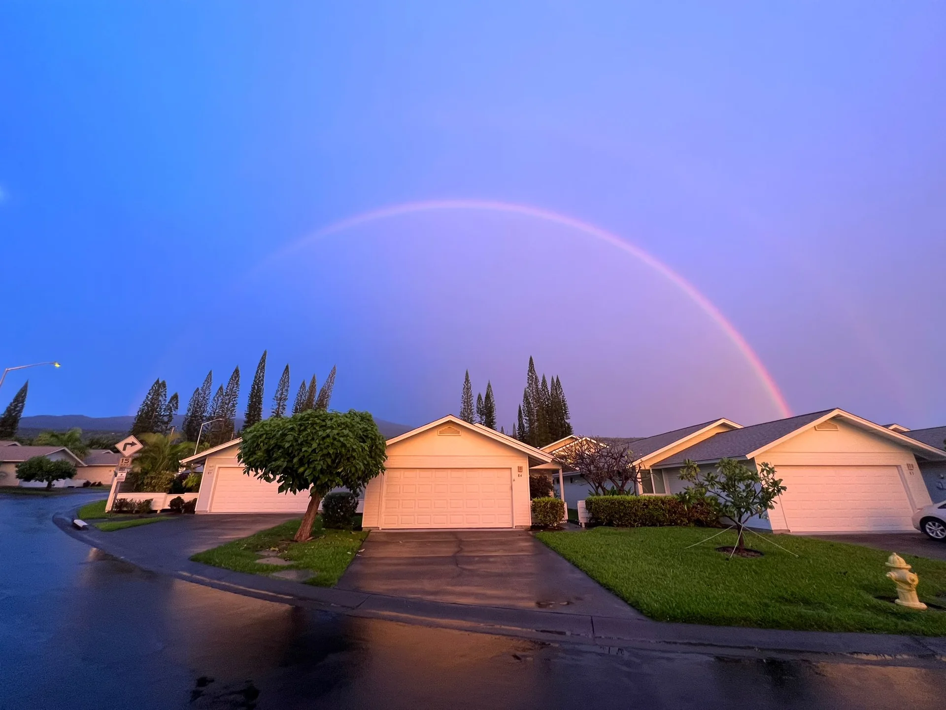 Rainbow over homes in the Pines I community in Kailua-Kona, Hawaiʻi